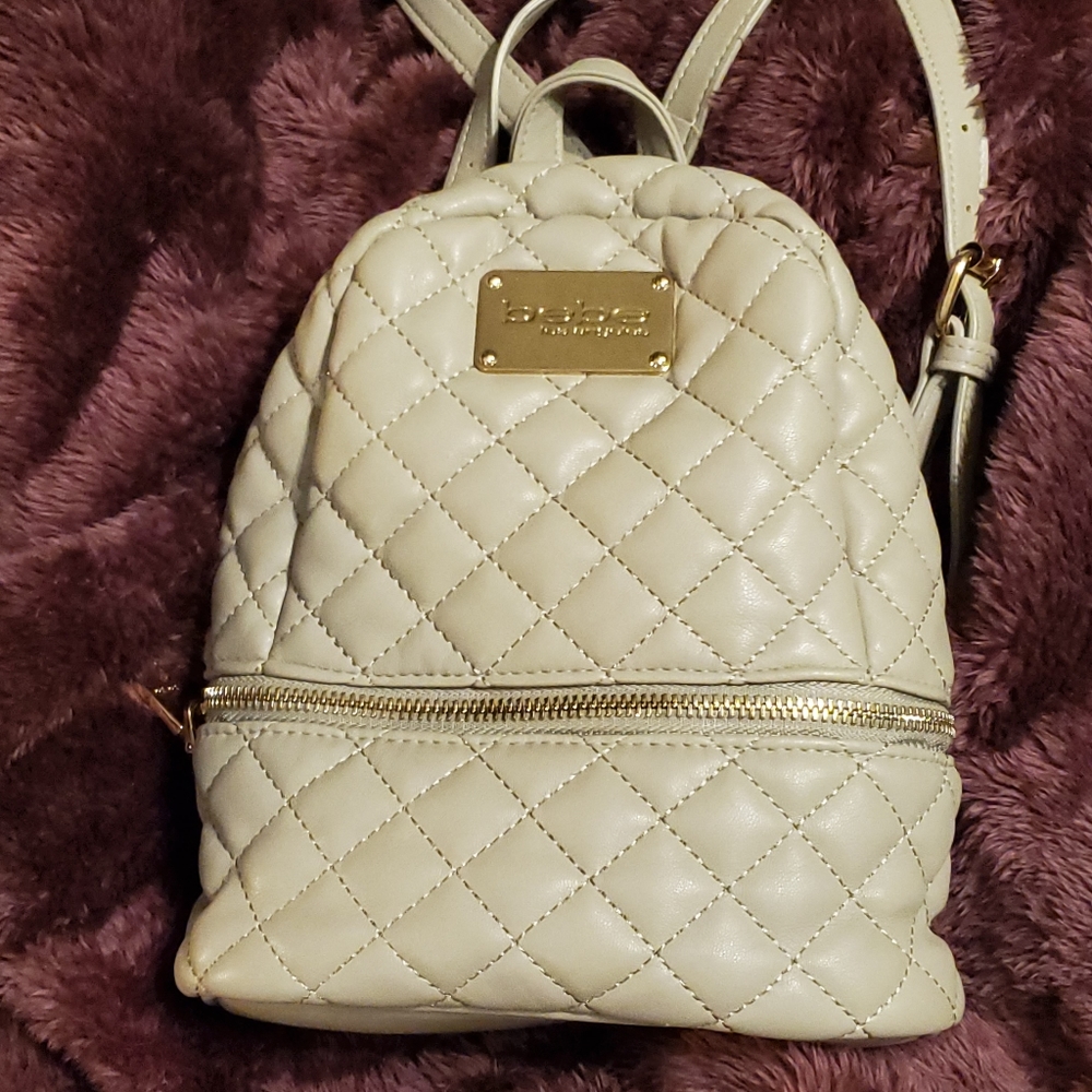 Small taupe bebe backpack.